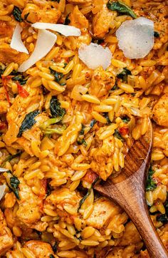 pasta with chicken, spinach and parmesan cheese in a large skillet