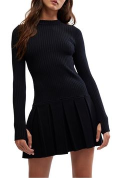 An elevated take on the classic sweater dress, this mini is featured in a flattering drop-waist silhouette and long-sleeve style with a pleated skirt perfect for any event!Fitted, Drop waist61% Viscose 27% Polyester 11% Polyamide 1% ElastaneMachine Wash Cold Medium Wash Long Sleeve Mini Dress With Pockets, Fitted Knit Mini Sweater Dress, Elegant Black Mini Sweater Dress, Winter Cable Knit Mini Sweater Dress, Pleated Mini Skirt With 4-way Stretch, Pleated Skirt Mini, Elegant Black Dress, Classic Sweater, Versatile Dresses