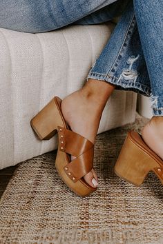 The perfect summer shoe just dropped! Our boho 'Mellow' heel features two wide brown faux leather crossed over-the-foot straps, a rounded open toe, a platform sole with a block heel, and a chunky slip-on silhouette! - This heel runs more true to size. - Heel Height: 3.5 inches Summer Shoe, Faux Leather Heels, Clogs Shoes, Perfect Summer, Summer Shoes, Leather Heels, Online Boutique, Block Heels, Open Toe