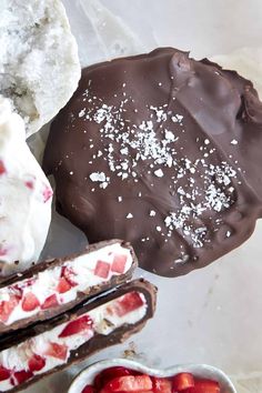 chocolate covered doughnuts, strawberries and other dessert items