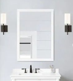 a bathroom vanity with two sinks and a mirror on the wall next to a toilet