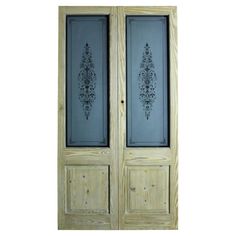 an old wooden door with two glass panels