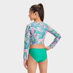 Add a touch of tropical style with the Abstract Tropical Jungle Flowers Bikini Set from art class™. This three-piece bikini set includes a bikini top and long-sleeve rash guard with an abstract tropical print, plus a solid green bikini bottom to complete the look. Made from recycled polyester with stretchy spandex, this swimwear set offers comfort during waterside activities. Plus, with a UPF 50+ rating, these pieces help keep their skin shielded from the sun's rays. art class™: One-of-a-kind lo Jungle Flowers, Teen Summer, Solid Green, Swimwear Sets, Tropical Style, Coral Orange, Kids Outfits Girls, Swimwear Fashion, Pair Of Pants