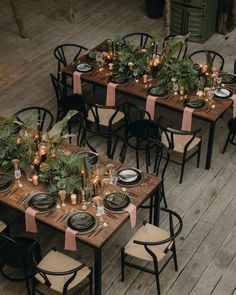 tables set up with place settings and candles