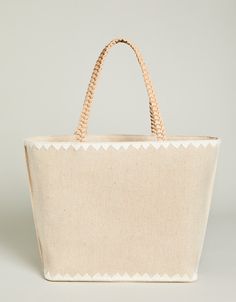 The best party is a beach party and our Fiesta Tote is always ready to come along! Decorated with palm beach embroidery on a cotton and jute blend, this tote features a fun, tiered tassel fob and a faux leather bottom base to keep it dry. The custom patterned cotton interior features 2 slip pockets and 1 hanging zipper pocket. Summer Beige Bags With Canvas Lining, Summer Beige Bag With Canvas Lining, Beige Summer Bags With Canvas Lining, Beach Bags With Leather Handles In Cotton, Beach Bags With Leather Handles And Cotton Material, Vacation Cotton Bag With Embroidery, Spring Vacation Embroidered Straw Bag, Embroidered Cotton Vacation Bag, Embroidered Cotton Bag For Vacation