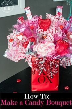 a red bag filled with candy and candies sitting on top of a table next to a window