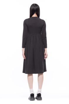 Think Audrey Hepburn classic cool chic dress. An easy pieces for a colder weather with long sleeves and mock neck. Garment Workers, Easy Stretches, Body Conscious, Mock Neckline, Mid Dresses, Material Design, Audrey Hepburn, Small Batch, Chic Dress