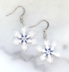 LACE & BEADS in Fine Cotton Thread featured in these unique Snowflake Earrings. Many styles & colors here: www.LacyTreasures.ETsy.com  #lacytreasuresjewelry #snowflakeearrings #uniquejewelry #winterball #stunningoneofakindjewelry #winteranniversary #wintervacationjewelry #holidayearrings #winterweddingjewelry #grandmothergift #mothergift #ballerinajewelry #wintersolsticeearrings #winterfestival #wholesalejewelry #skiearrings #skivacationearrings #christmasearrings #newyearsearrings #starnecklace Winter Wedding Jewelry, Christmas Hostess Gifts, Ballerina Jewelry, Vacation Jewelry, Winter Earrings, Lace Earrings, Snowflake Earrings, Festival Jewelry