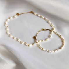 For the true pearl lover, this set of two luxury pieces of jewelry, consisting of a necklace and bracelet, is an absolute must-have. Made of gold-colored stainless steel and freshwater pearls, these jewelry are timeless and elegant in design. The chain has a length of 30cm and the bracelet is 15.5cm long. Both jewelry have a 5cm extension, so they can also be worn looser for a perfect fit. The combination of the gold-colored stainless steel and the freshwater pearls give this jewelry a luxurious Luxury Pieces, Schmuck Gold, Pearl Jewelry Sets, Set Jewelry, Pearl Set, Necklace And Bracelet, Gold Pearl, Necklace For Women, Beautiful Necklaces