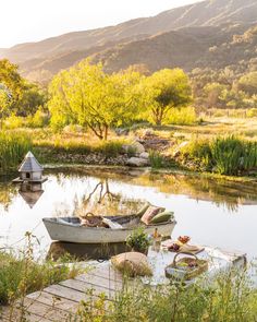 there is a boat that is sitting on the water and surrounded by other things in the water