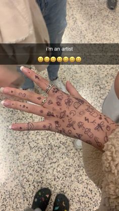 someone's hand with tattoos on it in the middle of an airport terminal area