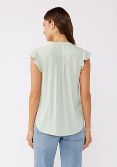 Our classic flutter sleeve top is elevated with delicate floral lace accents at the shoulders. The ruffled split v-neckline and button front complete this timeless boho blouse, making it a versatile piece for any wardrobe. We love pairing this feminine top with vintage denim or slacks for an effortlessly laid-back or polished look. Floral lace yoke Relaxed fit Short flutter cap sleeves Hip length Self-covered button front Classic bohemian blouse Model is 5'9, wearing a size S.Style: I-15419W-SUM Feminine Split Neck Blouse, Flowy V-neck Top For Workwear, Spring Rayon Top With Split Neck, Chic Viscose Blouse With Flutter Sleeves, Casual Ruffled Split Neck Blouse, Feminine Butterfly Sleeve Tops For Work, Feminine Tops With Butterfly Sleeves For Work, Flowy V-neck Feminine Tops, Casual V-neck Viscose Top For Spring