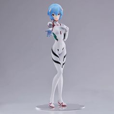 an action figure with blue hair and white skin is posed in front of a gray background