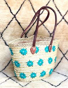 "Presenting our exquisite Handwoven Straw Basket Bag with Leather, meticulously crafted in Marrakech, Morocco, using palm leaves. Embracing \"Slow Fashion,\" it epitomizes eco-friendliness, ethicality, and sustainability.  In tune with the spring & summer trends, this versatile braided bag is ideal for various occasions, be it beach outings, grocery shopping, or as a chic holiday accessory.  Its multifunctionality extends to home storage, making it an indispensable companion you'll never want to leave home without. 🧺 DETAILS 🧺 Raw Material : 100% Woven natural palm straw, wild palm doumdoum eco friendly  Trim : 100% Vegan Leather, Removable canvas pouch with a zip top closure size : 41 x 30 x 26 cm = 16.1 x 11.8 x 10.2 inches  ✈️ Shipping methods ✈️ DHL or FedEx Express for convenient \" Moroccan Bags, Braided Bag, French Baskets, Straw Beach Bag, Chic Holiday, Canvas Pouch, Basket Bag, Unique Rugs, Beach Bag