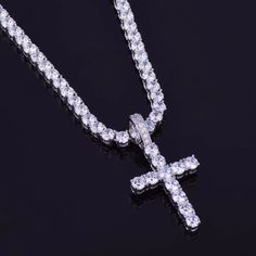 IceBox DC: ✨ Elevate Your Wrist Game in 2024 ✨ Men's 3mm Tennis Chain Cross Pendant Necklace (Shop Now!) Shine brighter than ever with this icy take on a hip-hop classic in 2024. IceBox DC's Men's 3mm Tennis Chain Cross Pendant Necklace is the ultimate way to level up your wrist game and showcase your faith in style in 2024. This meticulously crafted necklace features a gleaming gold-plated finish and a dazzling micro-pave AAAA cubic zirconia cross pendant. A Timeless Symbol for 2024 and Beyond The Perfect Hip-Hop Accessory: Embrace your love for the genre with this iconic iced-out cross pendant, a must-have for any trendsetter in 2024. Sparkling Brilliance: The micro-pave AAAA cubic zirconia shimmers with brilliance, catching the light and turning heads wherever you go in 2024. Enduring S Diamond Chain For Men Sterling, Nike Chain Necklace, White Bling Jewelry For Streetwear, Silver Tennis Necklace Gift, White Gold Cuban Link Tennis Necklace, Iced Out White Gold Tennis Necklace As Gift, Iced Out White Gold Tennis Necklace Gift, Gift White Gold Iced Out Tennis Necklace, Gift Iced Out White Gold Tennis Necklace