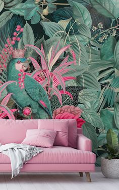 a pink couch sitting in front of a wall mural with tropical plants and birds on it