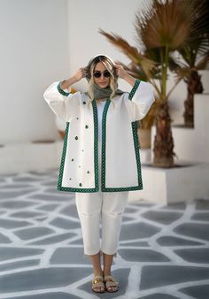 White women's coat with green border band and green decorative stones sewn on the coat.  The border band of the coat and sleeves is made of green velvet, with a string of small artificial pearls with a repetition of the infinity symbol sewn on it. Decorated with teardrop green stones on the front right side of the coat. Free size and suitable for sizes 36 up to 40 (EU size scale). Velvet Coat Women, Short Coats Women, Iranian Fashion, Fall Fashion Coats, Decorative Stones, Velvet Dress Designs, Iranian Women Fashion, Fashion Top Outfits, Boho Jacket