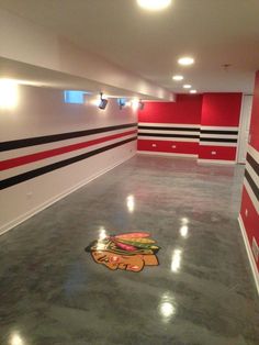 an empty room with red and black striped walls