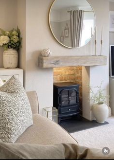 a living room filled with furniture and a fire place