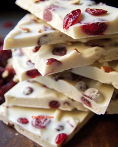 white chocolate with cranberries and nuts is stacked on top of each other