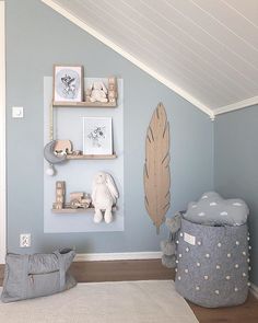 the room is decorated in pastel blue and white