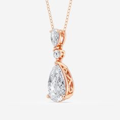 A celebration of smooth curves and sharp edges, this hinged pear shape diamond pendant radiates with effortless elegance. A solitaire lab grown pear shaped diamond creates a beautiful reflection against a smaller pear shaped and round diamond, promoting the elongating effect of this refined shape. Style this pendant on its own for a subtle sparkle or make it the most beautiful part of your layered look. Elegant Pear-shaped Drop Necklace For Formal Occasions, Elegant Teardrop Drop Necklace For Formal Occasions, Timeless Pear-shaped Diamond Necklace For Wedding, Pear-shaped Cubic Zirconia Diamond Necklace For Formal Occasions, Fine Jewelry Pear-shaped Drop Necklace For Formal Events, Elegant Pendant Drop Necklace With Brilliant Cut, Luxury Pear-shaped Drop Necklace For Wedding, Formal Pear-shaped Cubic Zirconia Diamond Necklace, Elegant Pear-shaped Diamond White Necklace