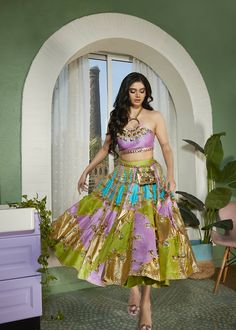 Twilight is a tri-colored panel embellished half lehenga set designed to make you stand out from the crowd. Expertly crafted from raw silk with panels of cerulean blue, gold, mint, and lilac, creating a visually striking effect that is sure to turn heads. The panels are embellished with shimmering glass stones, metal pieces, and glass cut beads. Pair it with the original Papa Don't Preach ring blouse in lilac with 3D embroidery. Festive Anarkali Embellished Skirt, Fusion Style Festive Silk Lehenga, Fusion Silk Sets For Festivals, Fusion Style Choli For Diwali With Traditional Drape, Fusion Multicolor Designer Wear Sets, Festive Fusion Sets With Resham Embroidery, Festive Multicolor Embellished Lehenga, Fusion Style Multicolor Designer Sets, Festive Fusion Style Sharara