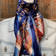 Our classic wild rag/scarf  in a blue color is accented with a multi-floral pattern. A perfect square - measuring 35"x35". Adding that extra touch of a western style to your outfit. 100% soft silk feeling polyester is durable to keep you warm in the cold and fashionable for any occasion. Plus it's machine washable!  Additional accessories are available- (Please see our slide options on our site)  *Leather slides *Western concho slides *Crystal concho slide  *Buckle slides Blue Bandana Scarf As Gift, Blue Bandana As Gift, Blue Square Scarves For Gifts, Blue Silk Scarf As Gift, Blue Square Scarves As Gift, Bohemian Blue Bandana Scarf, Bohemian Blue Scarf Bandana, Outfit Western, Bright Pop