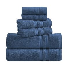 towels stacked on top of each other in dark blue color, with one folded and two folded