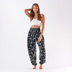 Lounge in style in our cute and comfy harem pants featuring our buttery soft fabric! Pair them with a cropped tee, bodysuit, or swimwear for maximum style and comfort. Great for lounge wear, yoga or on the move! Available in One Size Fits Most and Curvy Colors Available: Havana ( Mustard and White Mandala Print) Lava Island ( Black & Gray Tie Dye) - Sold out Corfu (Deep Teal & White Mandala) Galapagos (Lavender and White Mandala Print) - Sold out Sizing and Fit: OSFM: (SOLD OUT) Recommended for Casual Non-stretch Harem Bottoms, Casual Harem Yoga Pants, Casual Cotton Pants With Gathered Waist, Summer Stretch Cargo Pants For Loungewear, Relaxed Fit Bottoms With Gathered Waist For Loungewear, Comfortable Yoga Pants With Elastic Waistband, Casual Harem Bottoms For Vacation, Casual Harem Parachute Pants For Yoga, Summer Tapered Leg Sweatpants With Elastic Waistband