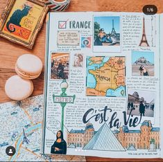 an open travel book with pictures and other things on top of it, next to a cup of coffee