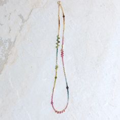 "While it may not be a common practice, I especially choose to rearrange each of the tiny beads when creating this necklace. This allows for a gentle gradation of colors, creating a smooth transition between different shades of tourmaline and resulting in a beautiful and harmonious necklace. By taking the extra time and effort to carefully arrange the beads, I can create a unique and personalized piece that showcases the full range of colors found in tourmaline. You will receive the same necklac Tourmaline Beaded Necklaces For Jewelry Making, Multicolor Tourmaline Beaded Necklace With Faceted Beads, Multicolor Tourmaline Faceted Beads Necklace, Tourmaline Stone, Watermelon Tourmaline, Jewelry Organization, Gold Beads, Spring Rings, Layered Necklaces