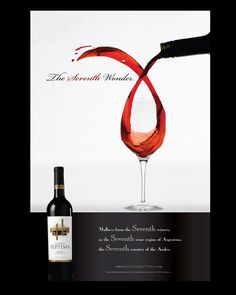 a bottle of red wine being poured into a glass next to an advertisement for the seventh world's wines