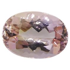 an oval shaped pink diamond on a white background