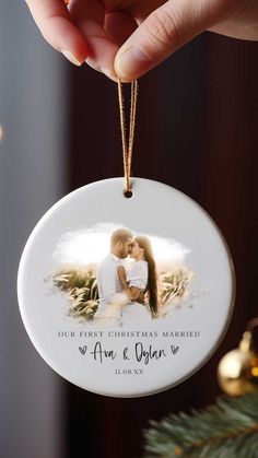 a christmas ornament with an image of a man and woman kissing on the cheek