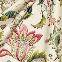 a close up view of the fabric with flowers and leaves on it, in various colors