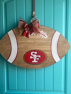 a football shaped door hanger with the word san francisco on it