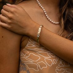 Adorned with tropical flowers, ferns, leaves and intricate scrollwork, our unique Hawaiian Heirloom designs are cherished Island keepsakes with tradition that traces back to Hawai‘i’s Queen Lili'uokalani. Hawaiian Heirloom Plumeria Design Hinge Bracelet with safety clasps 14k Yellow Gold, 14k Rose Gold and 14k White Gold Natural Diamond: 0.075 CTW 8mm Thickness Exclusively Made in Hawaiʻi Forever Guarantee (Warranty on the life of the piece) Free Shipping on USA Orders $100 or more Adjustable Heirloom Jubilee Bracelet, Fine Jewelry Oyster Bracelet For Anniversary, Heirloom Etched Bracelet Jewelry, Hammered Bracelets For Anniversary, Luxury Hammered Jewelry For Weddings, Adjustable Etched Jewelry, Etched Bangle For Wedding, Nature-inspired Hammered Jewelry For Anniversary, Adjustable Etched Nature-inspired Jewelry