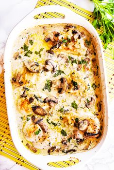 a casserole dish with mushrooms and cheese