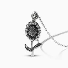 Jeulia "Blooming Sunflower" sterling silver necklace. sunflowers, are flowers that yearn for brightness. They grow towards the sun, symbolizing health, happiness, and vitality, and symbolizing the pursuit of a positive life. They always show a positive attitude and are the most attitudinal flowers. Sunflower necklaces are regarded as a symbol of happiness, and people often give them as gifts to others to express their blessings and happiness.Weight: 3.46 gWidth: 12.5 mmHeight: 22 mmThickness: 3. Elegant Silver Necklace With Sunflower Design, Silver Sunflower Design Necklace, Silver Sunflower Design Flower Necklace, Silver Sunflower Pendant Jewelry, Silver Sunflower Pendant Necklace, Silver Necklace With Sunflower Pendant, Silver Jewelry With Sunflower Design Flower Pendant, Madison Lee, Blooming Sunflower