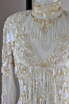 Intricate Embroidery Floor-length Gown For Wedding Reception, Floor-length Gown With Intricate Embroidery For Wedding Reception, Floor-length Embroidered Gown For Wedding Reception, Elegant Floor-length Gown For Wedding Reception, White Embellished Gown For Reception, Festive Embellished White Wedding Dress, Traditional Beaded Wedding Dress, Traditional Embellished Wedding Dress For Party, Elegant Embellished Festive Wedding Dress