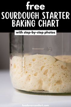 a glass jar filled with flour sitting on top of a white counter next to a black and white sign that says free sourdough starter baking chart