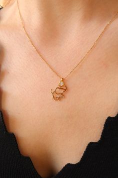 Heartfelt 14K Gold Elephant Necklace - Captivating Love at the Trunk Love Story: 14K Gold Elephant Necklace - Elephant Grasping a Heart Elevate your style with this enchanting 14K gold elephant necklace featuring a heart-shaped trunk. The adorable elephant pendant, crafted with precision, captures a beautiful love story with the heart it holds at the tip of its trunk. The elegant design and meticulous craftsmanship make this necklace a perfect accessory for various occasions. Whether you're expressing your love for elephants or seeking a meaningful piece, this necklace radiates charm and affection. Key Features: Material: 14K Gold Elephant-shaped pendant with a heart-shaped trunk Charming and heartwarming design Perfect for adding a touch of love to your style Gold Elephant Pendant, Elephant Necklace Gold, Necklace Minimalist Jewelry, Buy Gold And Silver, Elephant Jewelry, Jewelry Delicate, Animal Necklace, Gold Elephant, Luxe Jewelry