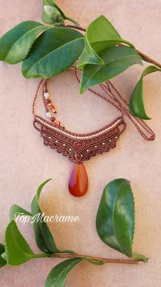 This beautiful necklace is made for a women with unique and alternative style. It's made by hand using macramé technique with waterproof waxed thread. The necklace is easily adjustable and designed to fit comfortable. Materials: Carnelian stone, waxed thread Turquoise size: 18x35 mm Carnelian bead: 4 mm If you have any questions about this product, I will be happy to answer them. Brown Macrame Necklaces For Festivals, Brown Macrame Necklace For Festival, Hippie Brown Macrame Necklace, Handmade Adjustable Amber Necklaces, Handmade Amber Necklace With Adjustable Fit, Adjustable Red Hippie Necklace, Handmade Bohemian Carnelian Beaded Necklaces, Adjustable Bohemian Carnelian Beaded Necklaces, Adjustable Agate Necklace For Festivals