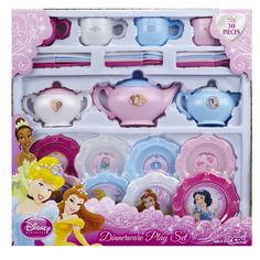 the disney princess tea set is in its box with other dishes and cups on it