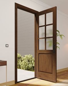 an open wooden door in a white room with wood flooring and plants on the wall