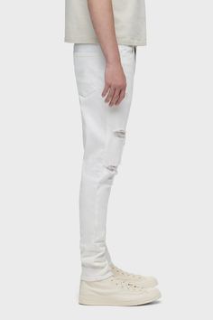 Description For a snug fit, look no further than our Zack Skinny Jean. Mid-rise, slim through the hip and thigh with a narrow leg. Unknown is a white wash, heavily distressed at the knee, it’s cut from 12.75-ounce Italian denim that has an authentic, worn-in vintage feel with a hint of stretch for added softness, comfort, and flexibility. Product Details 5 Pocket StyleFront Rise: 10.75", Knee: 15.5", Leg Opening: 11", Inseam: 32"Model Height 5'11"Model wearing size 32Measurements based on size 3 White Rigid Denim Jeans With Pockets, White Non-stretch High Rise Jeans, White Non-stretch Jeans With Pockets, Stretch Jeans With Five Pockets And 5-inch Inseam, Rugged Five-pocket Rigid Denim Jeans, Mid Rise, Snug Fit, Fabric Care, Pants