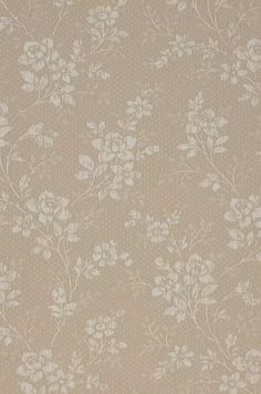 a beige wallpaper with white flowers on it