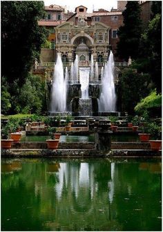 a large fountain in the middle of a park