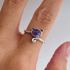 925 sterling silver  Stone: amethyst  Finish: oxidized  Height: 12.1 mm Can be worn: on multiple fingers and midi ring  Symbolizes: power, strength, purity, courage, rebirth, and resurrection Silver Sterling Silver Amethyst Ring Gift, Dainty Adjustable Amethyst Ring, Dainty Silver Amethyst Ring Gift, Purple Sterling Silver Stackable Rings For Gift, Adjustable Sterling Silver Amethyst Ring Gift, Nickel-free Amethyst Rings As Gifts, Silver Sterling Amethyst Open Ring, Dainty Silver Amethyst Rings, Purple Sterling Silver Open Ring